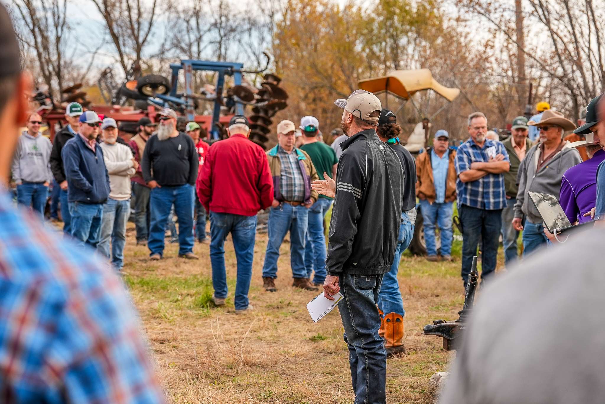 Sundgren Realty auction day - agents and buyers gathered at a Kansas farm auction